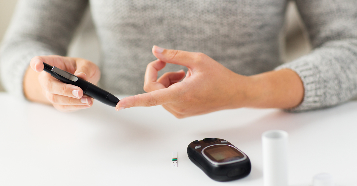 woman checking glucose